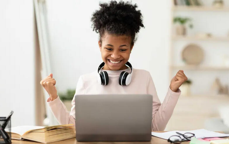 Girl excited after completing her Maths work